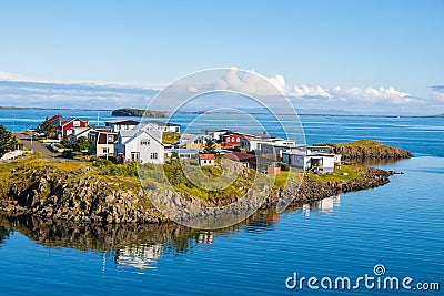 Sugandisey Cliffs, Iceland at Snaefellsnes Atlantic Ocean Sailing and Lighthouse of Island Landscape Stock Photo