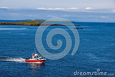 Sugandisey Cliffs, Iceland at Snaefellsnes Atlantic Ocean Sailing and Lighthouse of Island Landscape Editorial Stock Photo