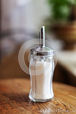 Sugar bowl on wooden table in a coffee shop Stock Photo