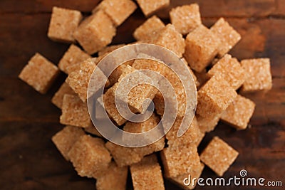 Sugar cane cubes closeup wooden table Stock Photo