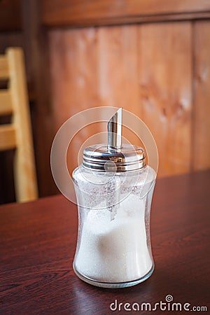 Sugar container on brown table Stock Photo