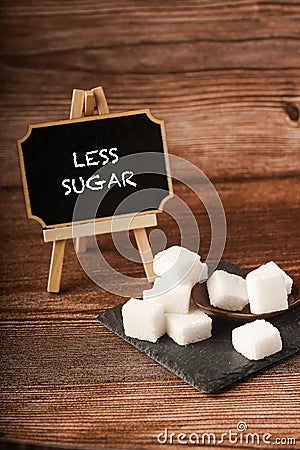 Sugar cubes with wooden spoon Stock Photo