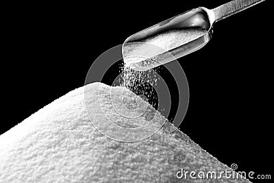 Sugar Falling from Tablespoon Stock Photo