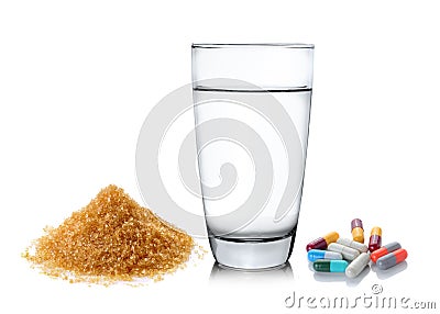 Sugar Glass of water and pills isolated on white background Stock Photo