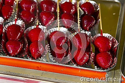 Sugar Glazed Strawberry Skewer in a street food stall in Tokyo Stock Photo