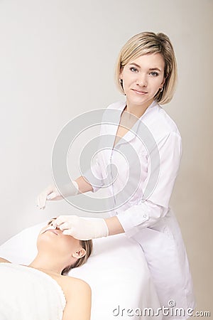 Sugar hair removal from woman body. Wax epilation spa procedure. Procedure beautician female. Mustache Stock Photo