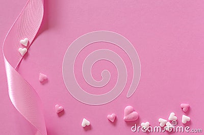 Sugar hearts and gift ribbon of pink backround Stock Photo