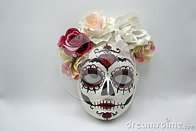 Sugar skull mask with flowers used for celebrating Day of the Dead in hispanic culture Stock Photo