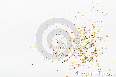 Sugar sprinkle dots on white background. Sweet decoration for cakes. Top view, copy space. Stock Photo