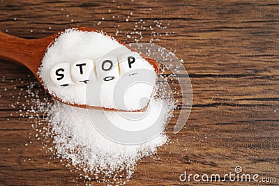 SUGAR, sweet granulated sugar with text, diabetes prevention, diet and weight loss for good health Stock Photo