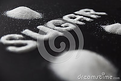 Sugar Word. White Sugar On Background Stock Photo