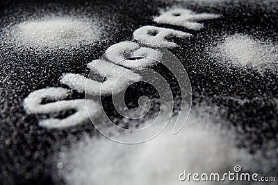 Sugar Word. White Sugar On Background Stock Photo