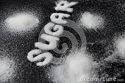 Sugar Word. White Sugar On Background Stock Photo