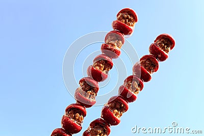 Sugarcoated haws on a stick Stock Photo