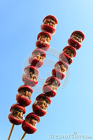 Sugarcoated haws on a stick Stock Photo