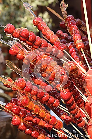 Sugarcoated haws on a stick Stock Photo