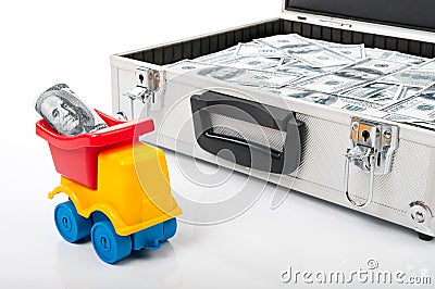 Suitcase full of money and model truck Stock Photo