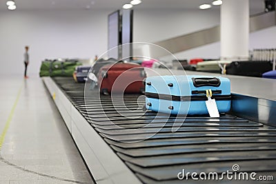 Suitcase or luggage on conveyor belt in the airport Stock Photo