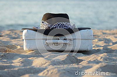 suitcase old is more white also a black hat Stock Photo