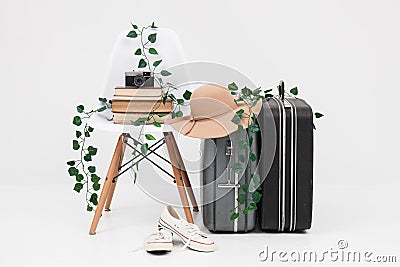 Suitcase with shoes, and cemera ready for travel Stock Photo