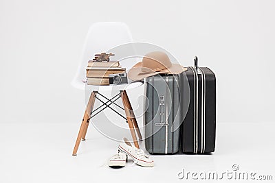 Suitcase with shoes, and cemera ready for travel Stock Photo