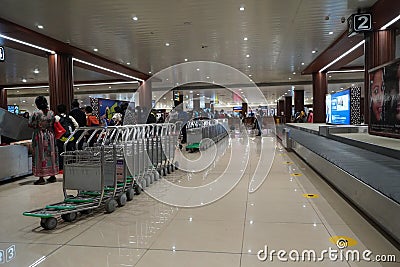 Suitcases or baggage on luggage conveyor belt in arrivals lounge of airport terminal. Selective focus. Luggage track at an airport Editorial Stock Photo