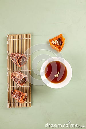 Sujeonggwa - Korean punch with cinnamon and dried persimmons. Dark reddish brown in color, it is made from gotgam dried persimmon Stock Photo