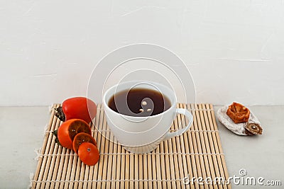 Sujeonggwa - Traditional Korean fruit tea or Persimmon punch Stock Photo