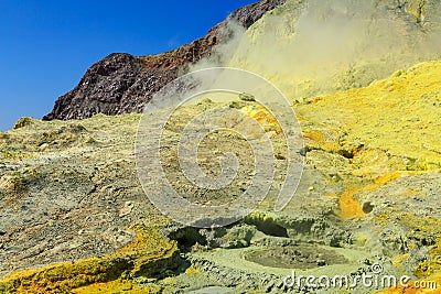 Sulfur deposits and a mudpot on White Island volcano, New Zealand Stock Photo