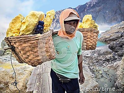 Sulfur Miner at Kawah Ijen Volcano, East Java, Indonesia Editorial Stock Photo