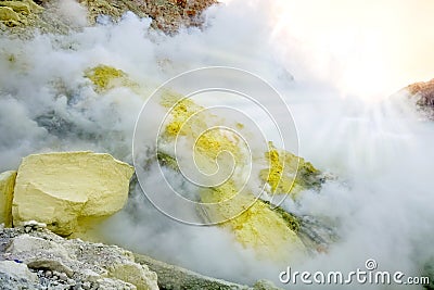 Sulfur rock in the crater of the Ijen volcano. The island of Java. Indonesia. Chemical natural background. Stock Photo