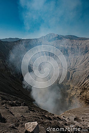 Sulfuric Embrace: Bromo's Vertical Steam Dance at Crater's Edge Stock Photo
