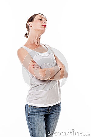 Sulking woman with arms folded posing with chin up for arrogance Stock Photo