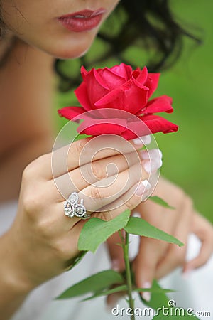 Sultry woman with single red rose Stock Photo