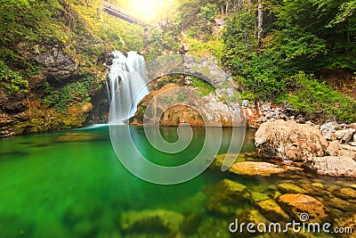 Sum waterfall and wooden bridge in the Vintgar gorge,Slovenia,Europe Stock Photo