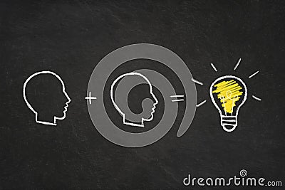 Sum of heads and a light bulb in a chalkboard. ` Stock Photo