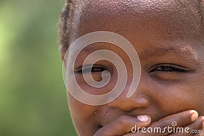 Detailed view of a child with expressive look on his face and eyes, portrait of African Angolan boy Editorial Stock Photo
