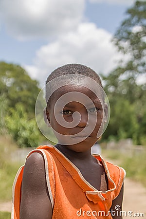View of a portrait of African boy, child with expressive look on his face and deep suffering eyes Editorial Stock Photo