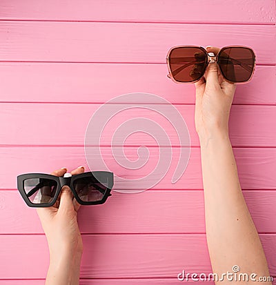 Summer abstract background mockup template woman hands hold Couple sunglasses fashionable Stock Photo