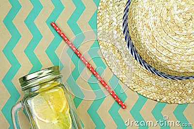 Summer accessories, Fresh summer drink and straw hat, Infused water. Stock Photo