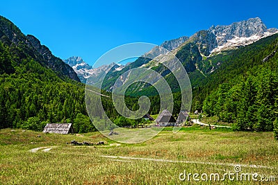 Summer alpine landscape with rural houses in Trenta valley, Slovenia Stock Photo