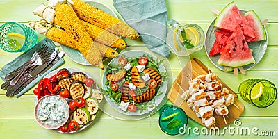 Summer bbq party concept - grilled chicken, vegetables, corn, salad, top view Stock Photo