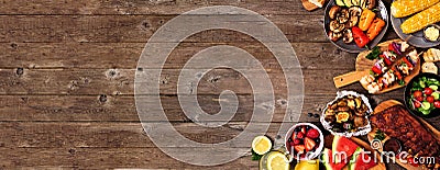 Summer BBQ or picnic food corner border over a rustic wood banner background, overhead view with copy space Stock Photo