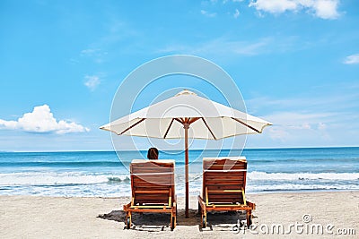 Summer Beach. Holidays Vacations. Woman Relaxing, Deck Chairs Stock Photo