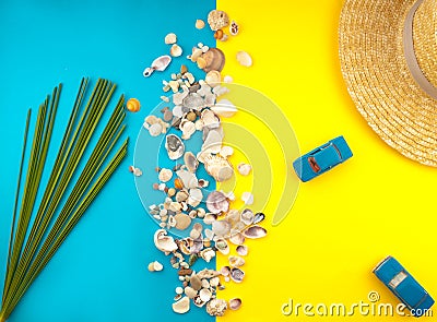 Summer Beach Travel concept. Palm Tree Leaf, straw hat, seashell, blue car on yellow background Stock Photo