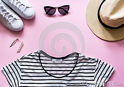 Summer beach travel outfit and accessories. Flatlay of a trendy woman fashion outfit. Stock Photo