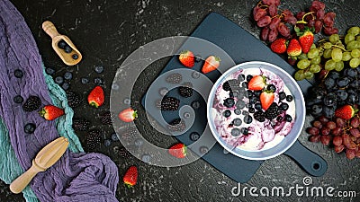Summer breakfast with yoghurt and berries creative flatlay top view Stock Photo