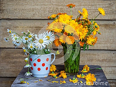 Summer bright bouquets, orange calendula and white daisy Stock Photo