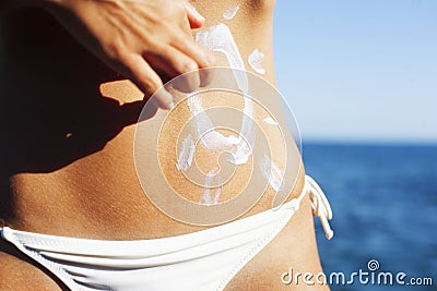 Summer bronze tanned woman skin in white bikini Stock Photo