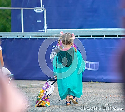 Summer cinema. Children watching a movie on the screen of a summer cinema Editorial Stock Photo